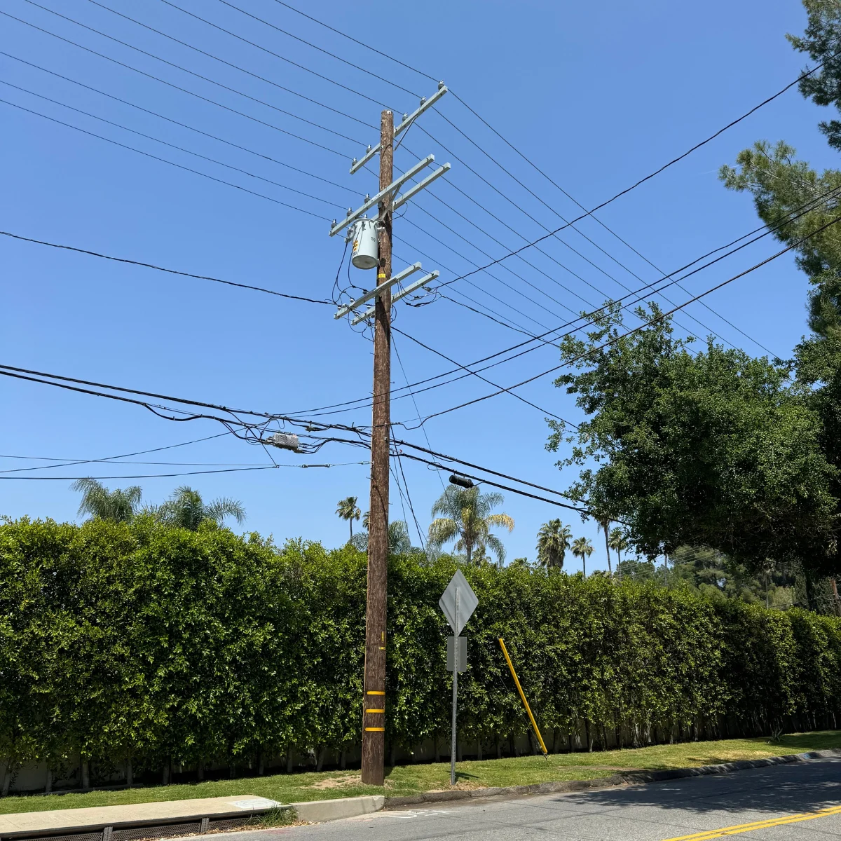 Utility pole on the corner of a 3 way intersection